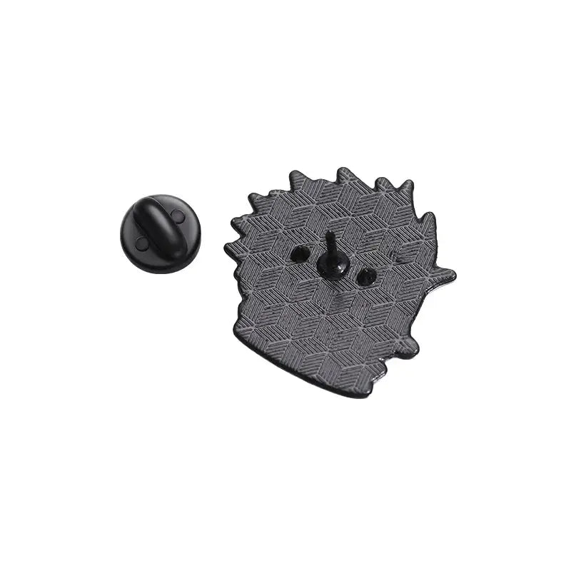 Cartoon enamel pin backplate in black with textured diamond pattern and butterfly clutch