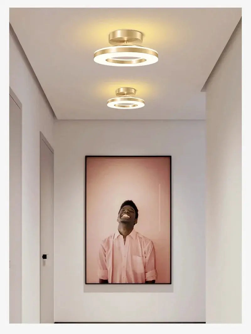 Modern LED ceiling lamp by Simples Market, gold ring design with dual fixtures in hallway