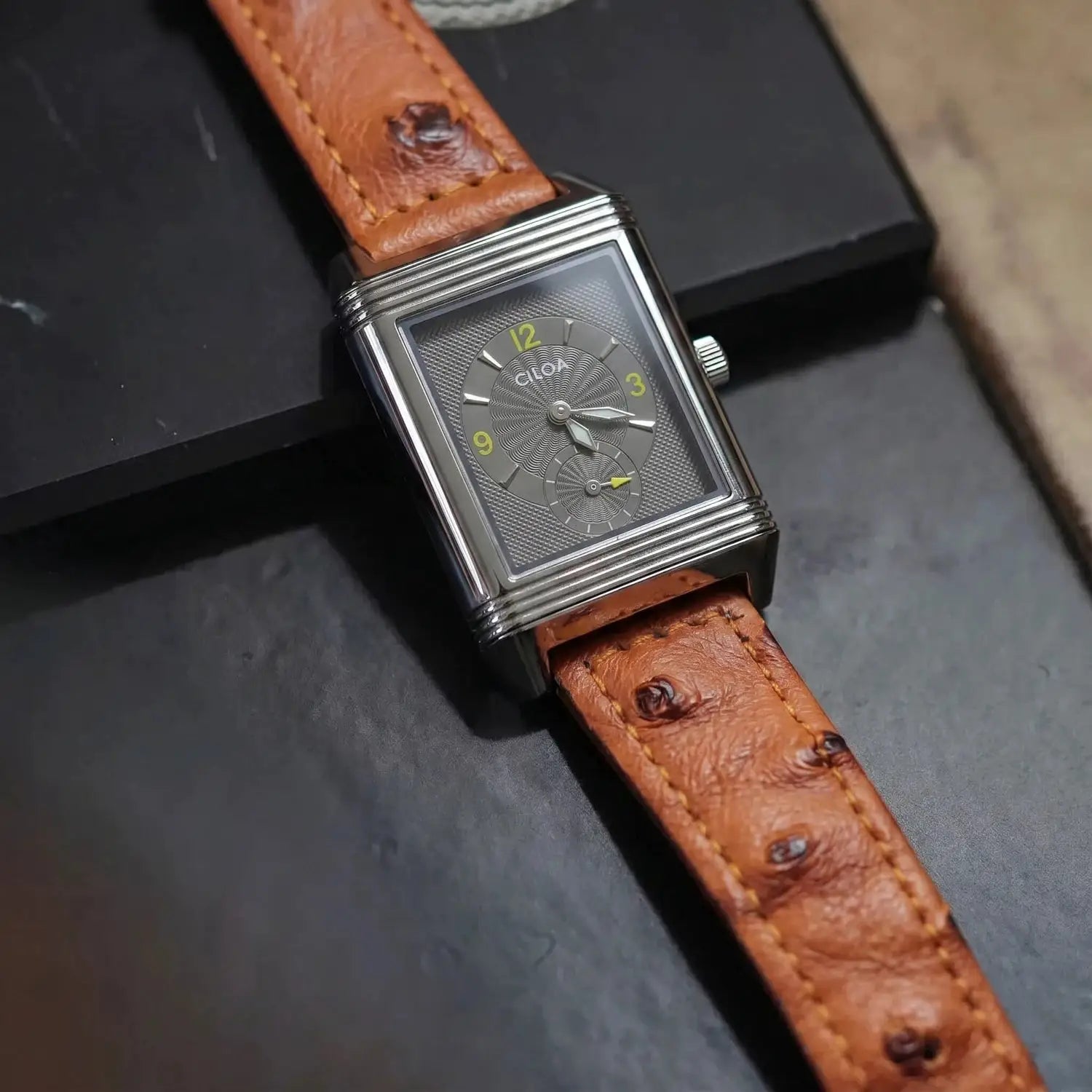 CILOA men's retro square quartz watch with silver case, grey dial, yellow numerals, and brown leather strap.