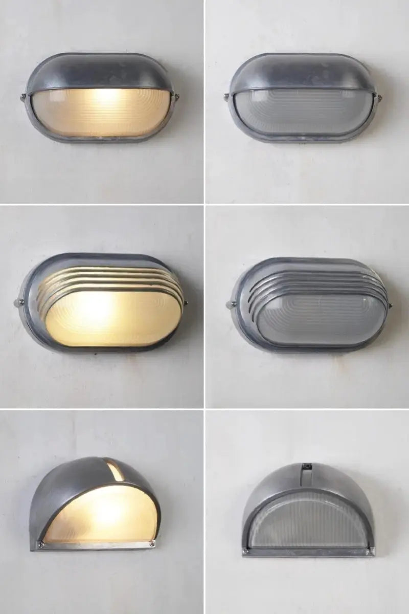 Outdoor retro LED wall lamp with gray metal housing and ribbed glass diffuser.