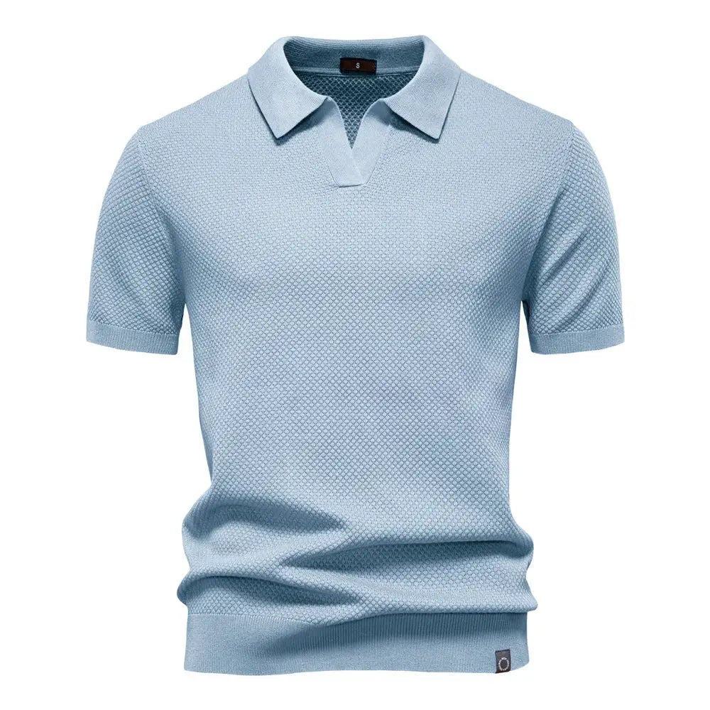 Men's golf polo shirt by Simples Market, light blue textured knit with breathable fabric.