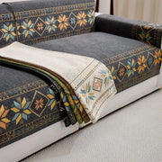 Bohemian jacquard chenille sofa throw by Simples Market with geometric multicolor pattern on dark gray sofa