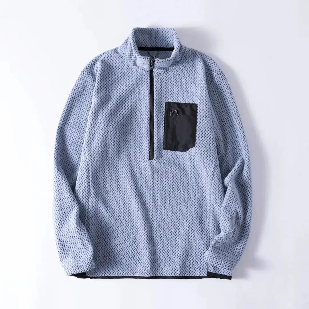 Simples Market unisex fleece sweatshirt with half-zip, long-sleeve, light blue wavy pattern and black chest pocket