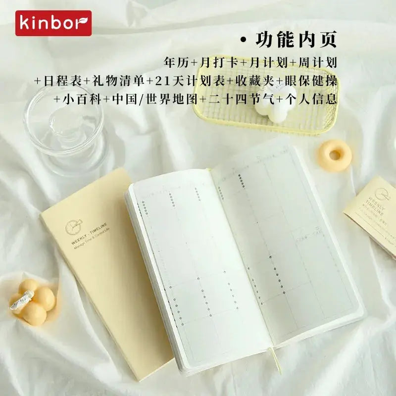 Kinbor weekly planner notebook with undated agenda and weekly layout, beige cover; Kinbor logo visible