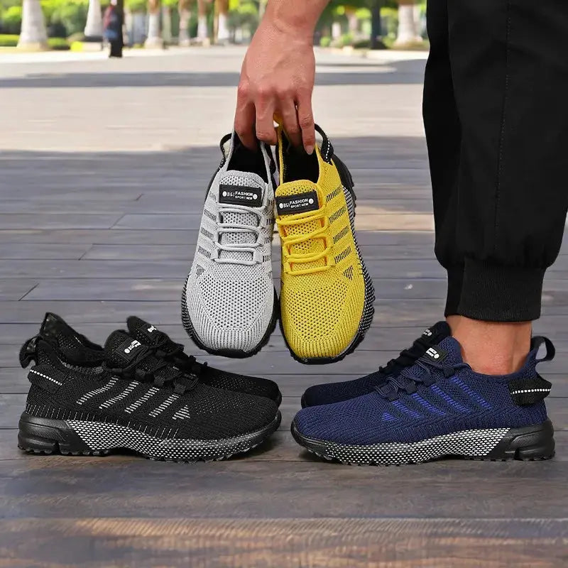 New men's sneakers with thick soles in gray, yellow, black and blue; four sneakers on display