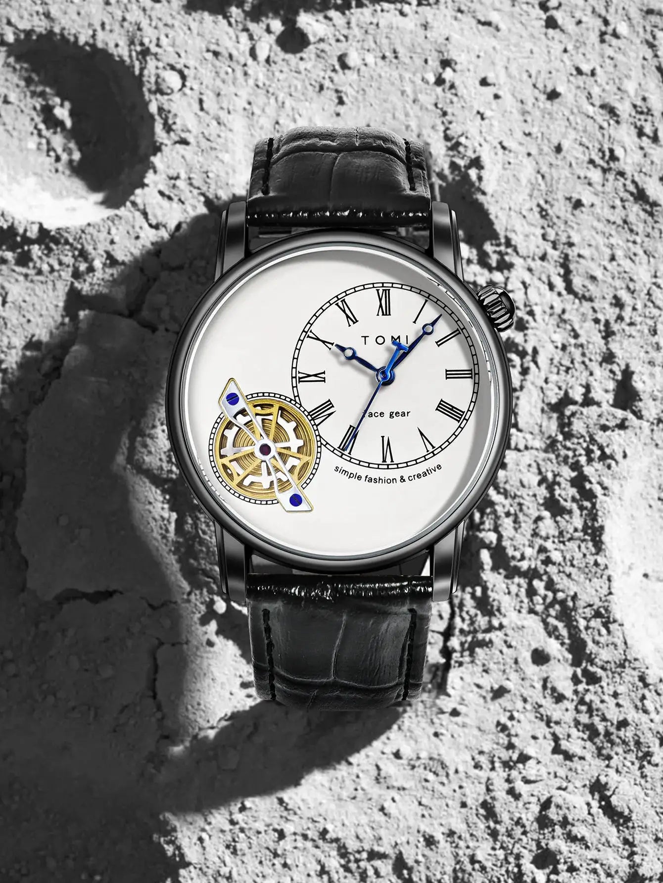 TOMI men's luxury quartz watch with white dial, Roman numerals, blue hands, visible gear wheel, black leather strap