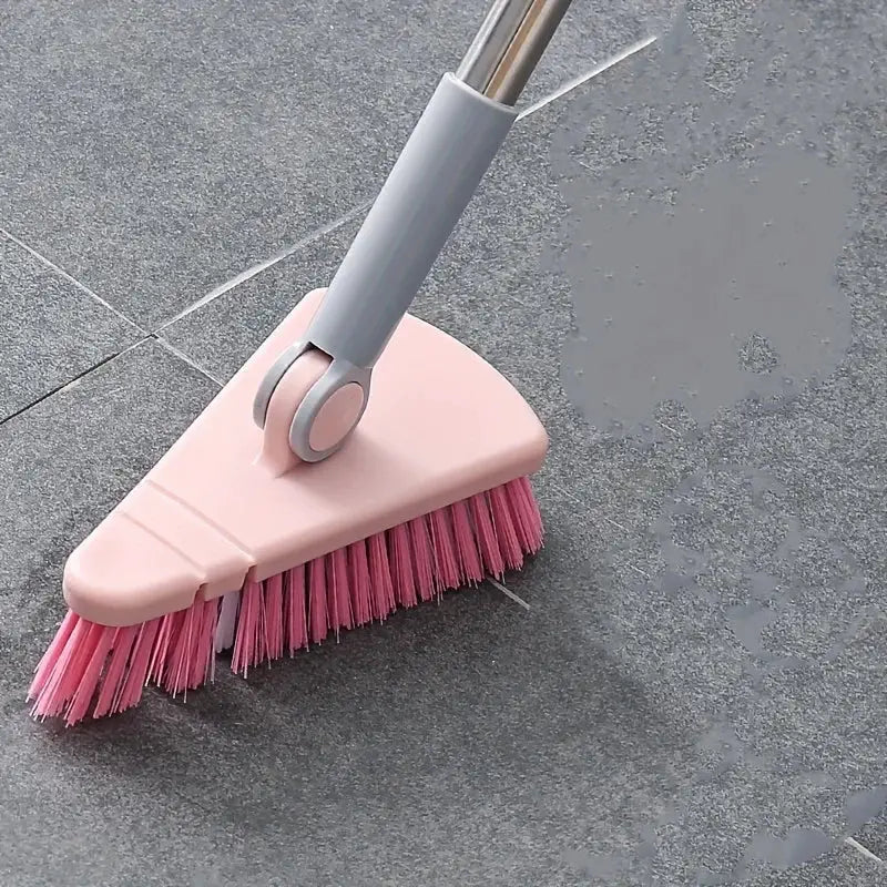 Triangle floor brush with pink bristles and pink head, long gray detachable handle