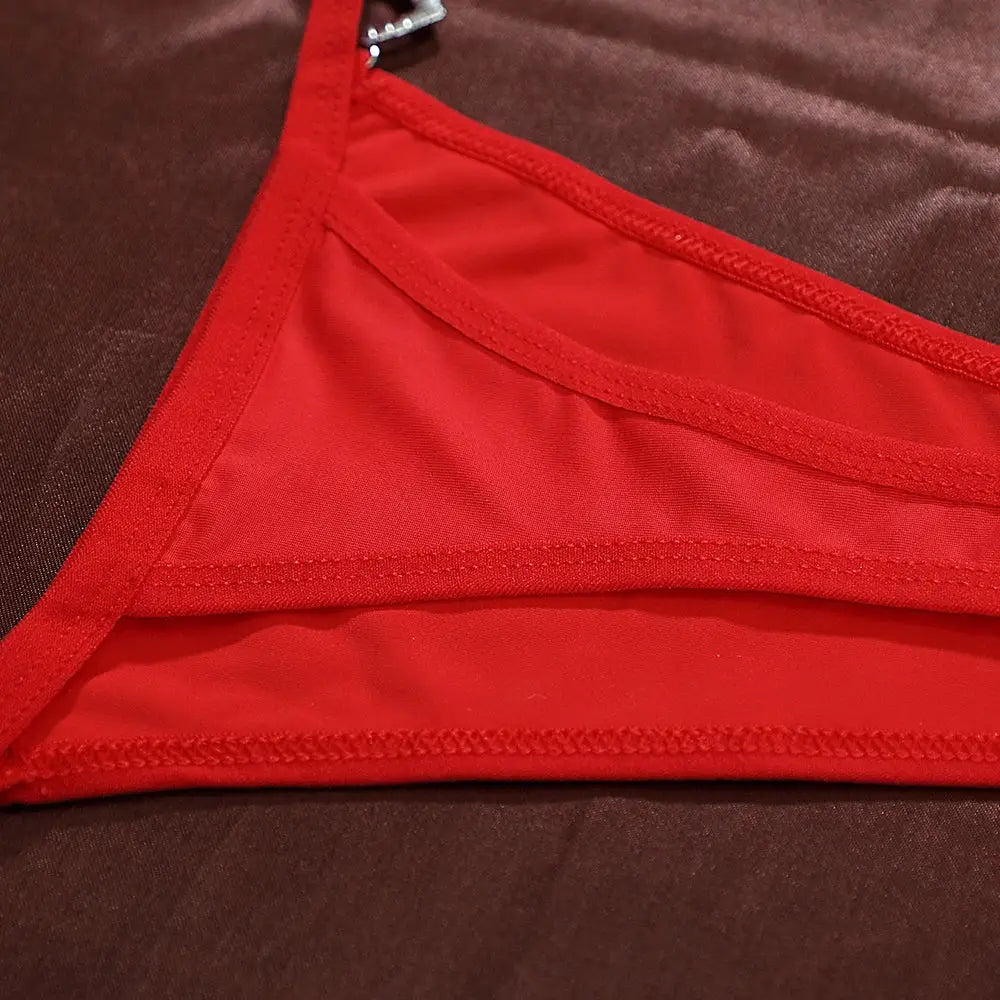 Women's red cotton thong underwear, low-rise G-string with neat stitching.