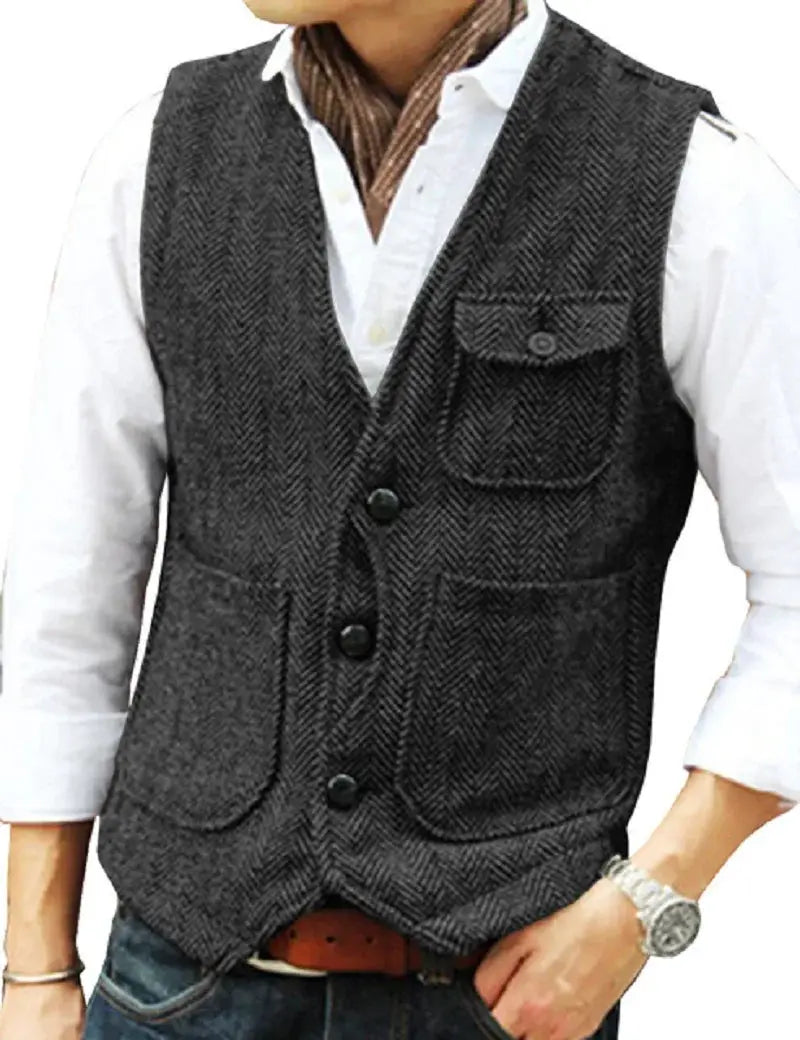 Men's brown herringbone wool tweed vest with V-neck, button front, chest patch pocket and two lower patch pockets