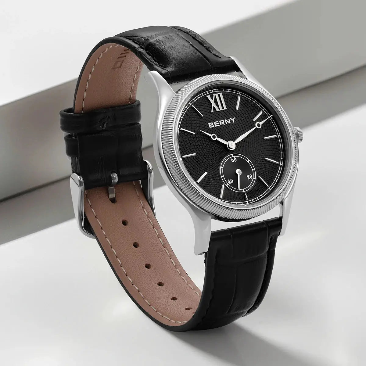BERNY men's dress watch with black textured dial, silver bezel, and black leather strap.