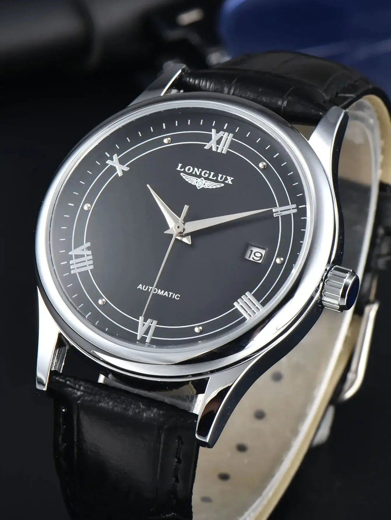 LONGLUX automatic men's watch with black dial, date window, and black leather strap.