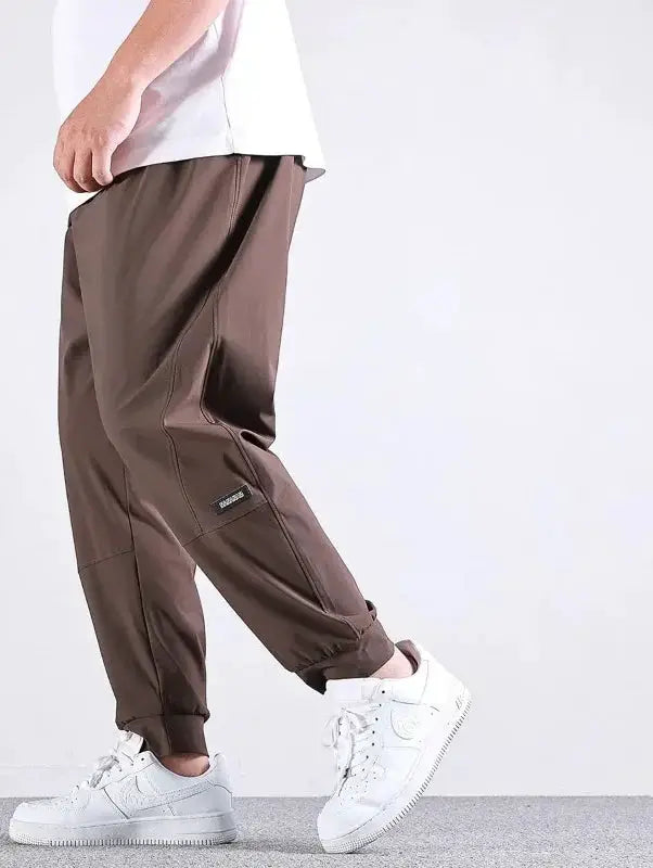 Men's 10XL brown quick-dry jogger pants with elastic waist, relaxed fit, cuffed ankles.