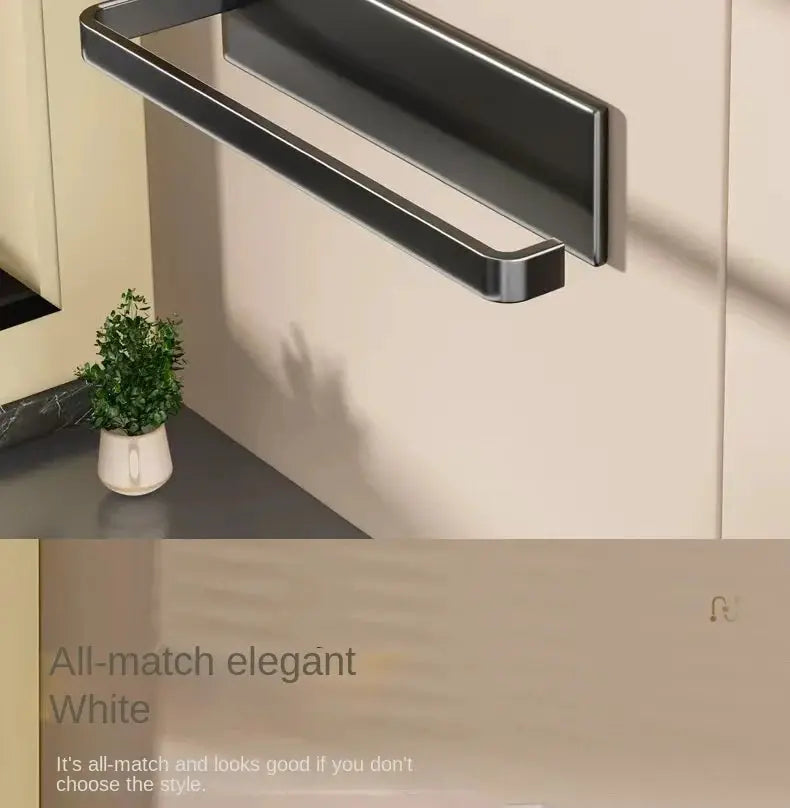 Wall-mounted kitchen paper towel holder by Simples Market in black metal with magnetic mount