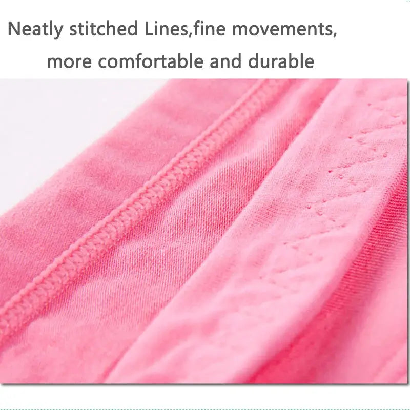 Women's pink cotton panties, breathable soft underwear with neat stitching close-up