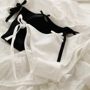 Alluring lace-up briefs in black and white with ribbon bows; two-piece set by Simples Market
