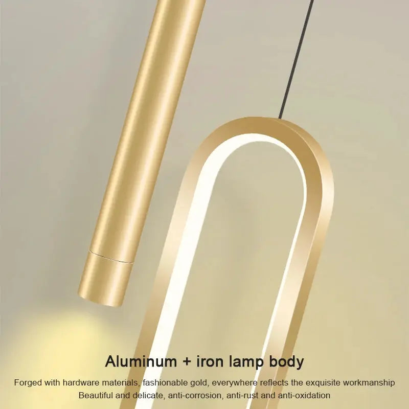 Gold Nordic LED pendant lamp with curved arched loop design; aluminum and iron body.