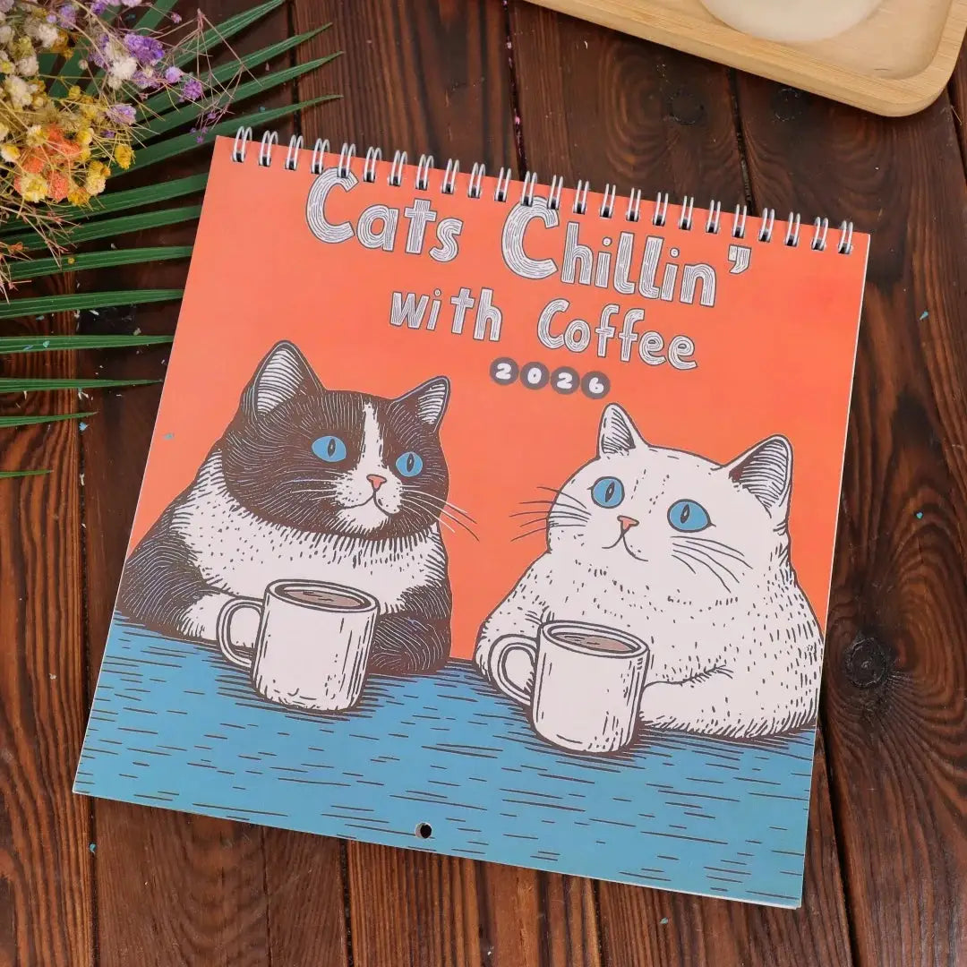 Creative Family Planner 2025 Funny Cat Art Calendar cover with two cats and coffee mugs, orange/blue, spiral-bound