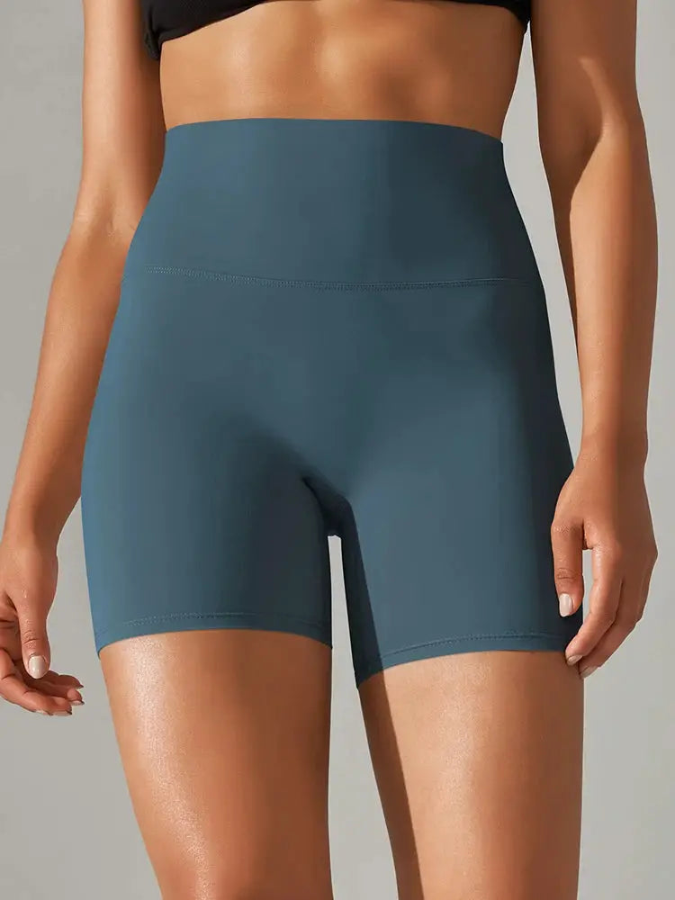 Women’s teal blue high-waist yoga shorts by Simples Market; squat-proof, quick-dry gym shorts