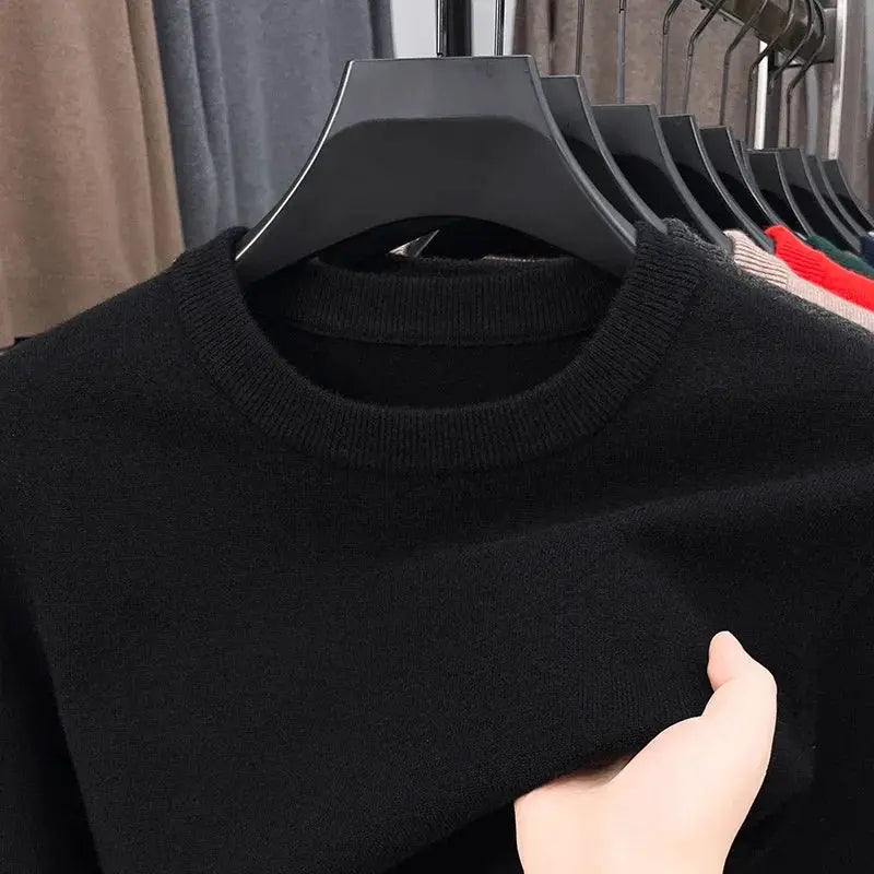 Men's black round-neck knitted sweater with long sleeves on a hanger