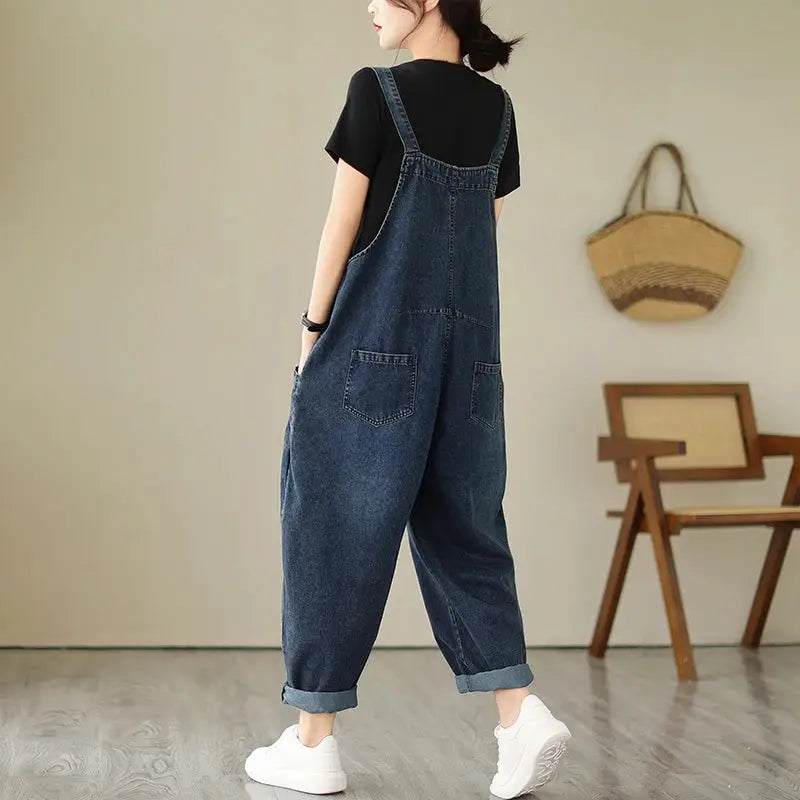 Women's blue denim overalls with suspenders, loose fit and pockets