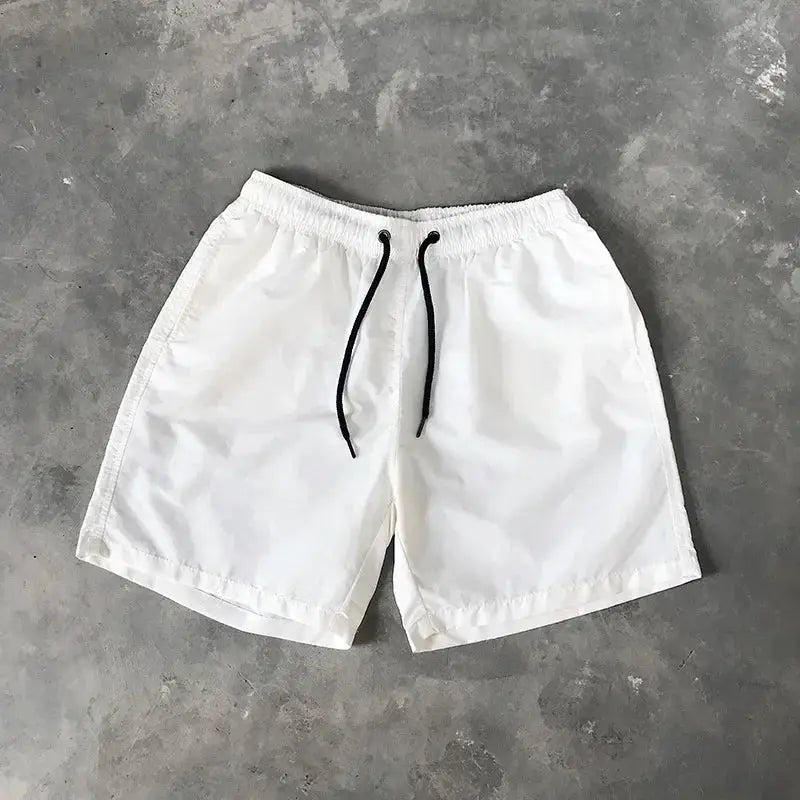 Men's swim shorts, white with black drawstring, lightweight beachwear
