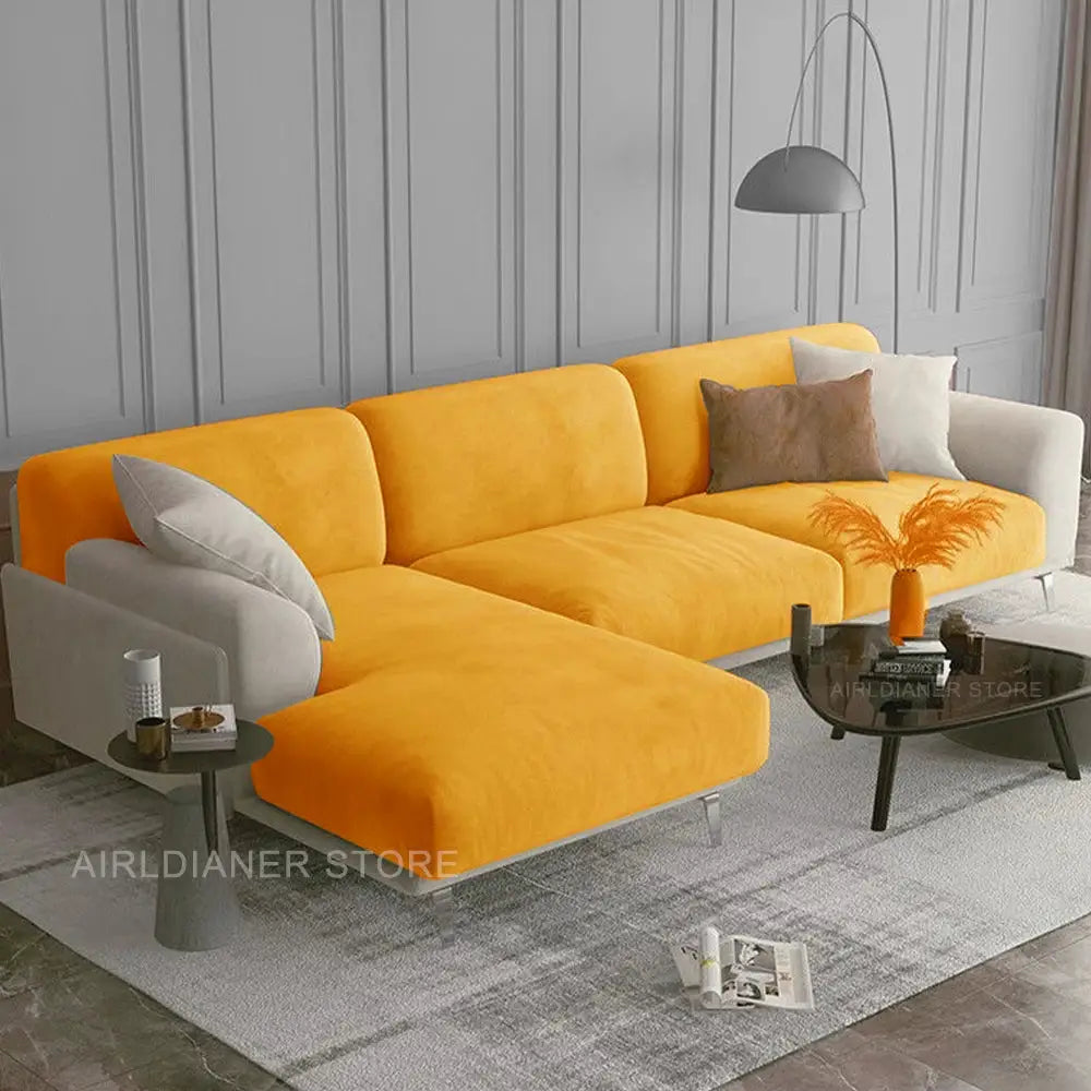 Velvet sofa cover in bright orange with elastic fit for a sectional living room sofa.