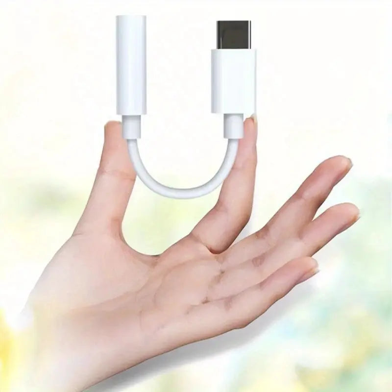 White Type-C to 3.5mm audio adapter cable, compact USB-C dongle.