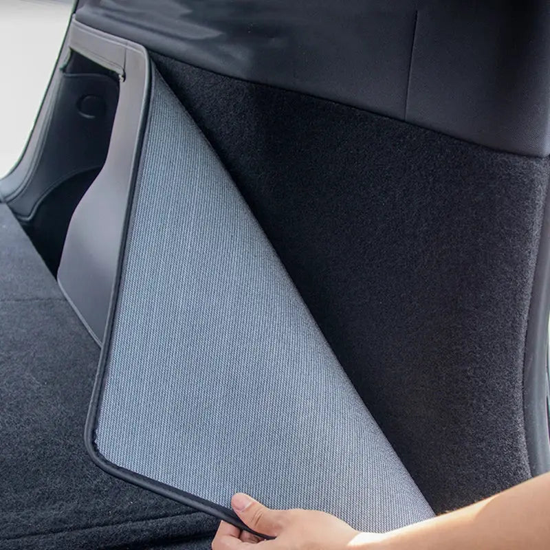 Tesla Model Y trunk mat with full-coverage gray fabric liner and side guards