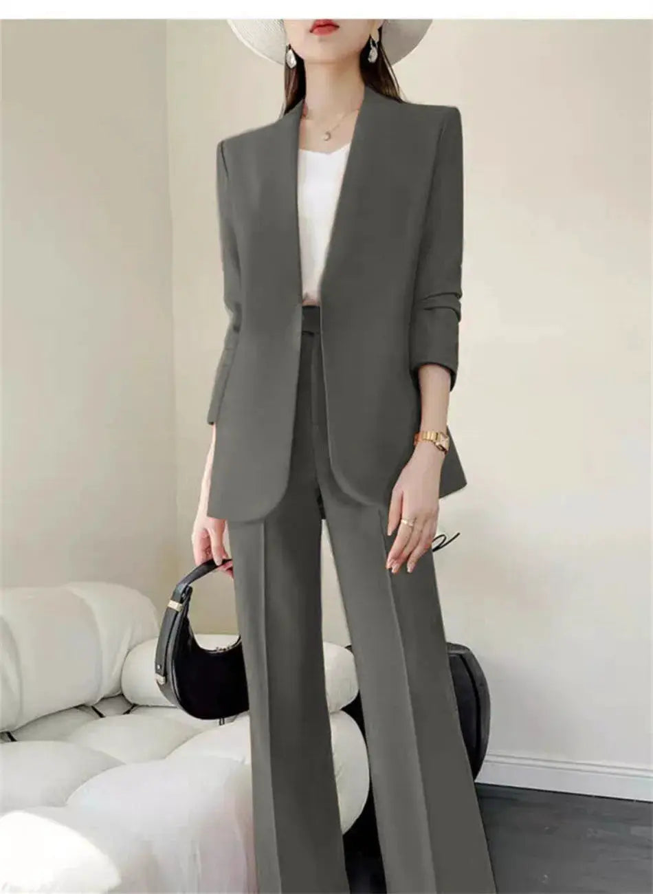 Gray 2-piece women's suit set with blazer and wide-leg trousers, worn with white top