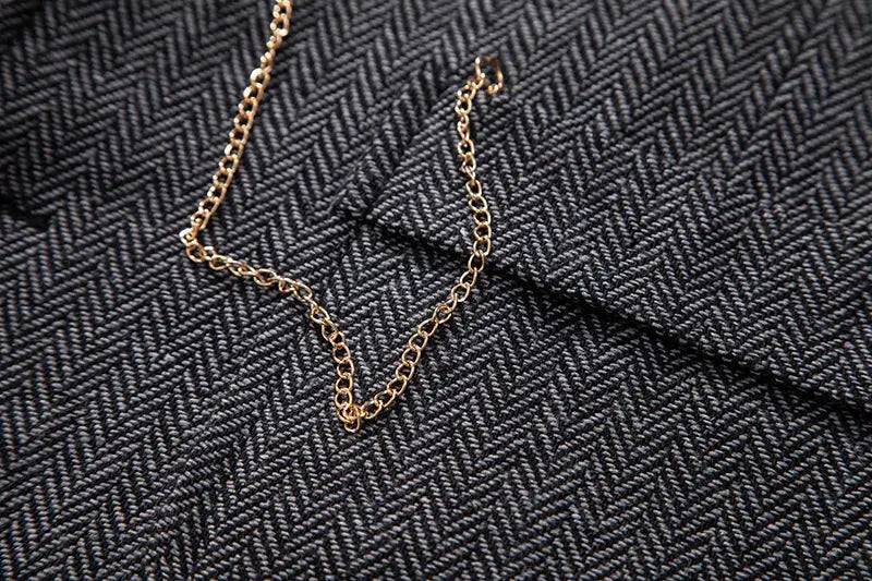 Men's retro lapel chain vest on grey herringbone tweed fabric, gold chain detail