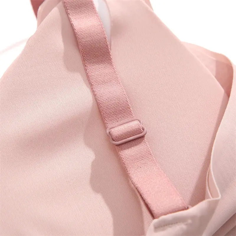 Pink push-up bra strap close-up on soft seamless lingerie fabric