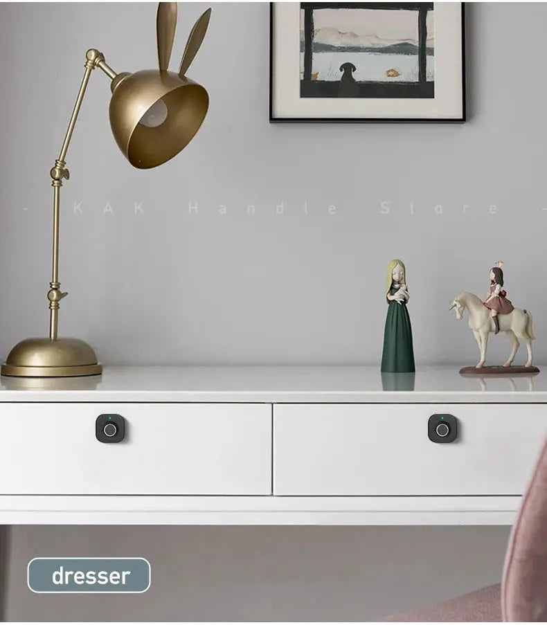 KAK Biometric fingerprint drawer lock; black keyless cabinet locks installed on a white dresser (pair)