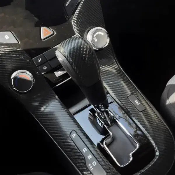 Black carbon fiber vinyl wrap on car center console and gear shifter area