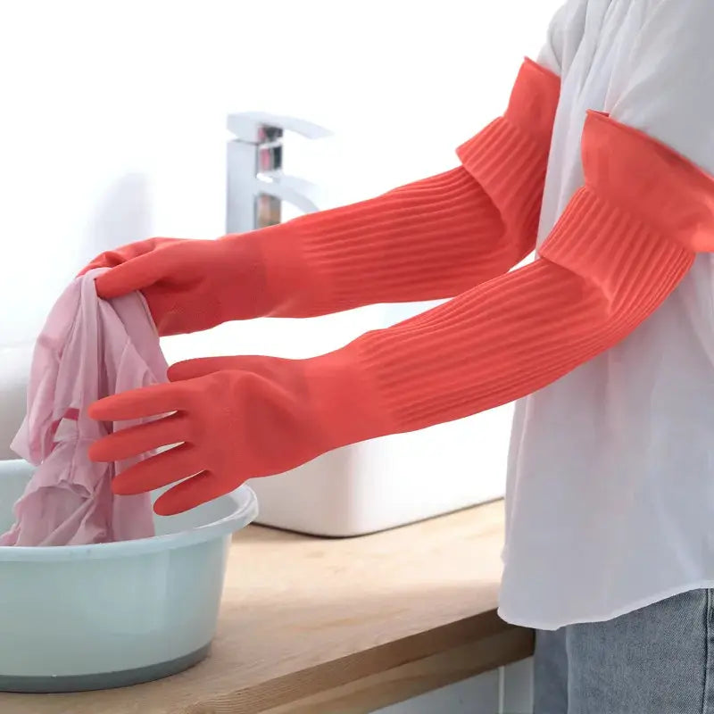 Silicone dishwashing gloves in coral red with long ribbed cuffs for kitchen cleaning