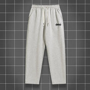 Men's grey solid-color jogging pants, straight-leg with drawstring waist and side pockets