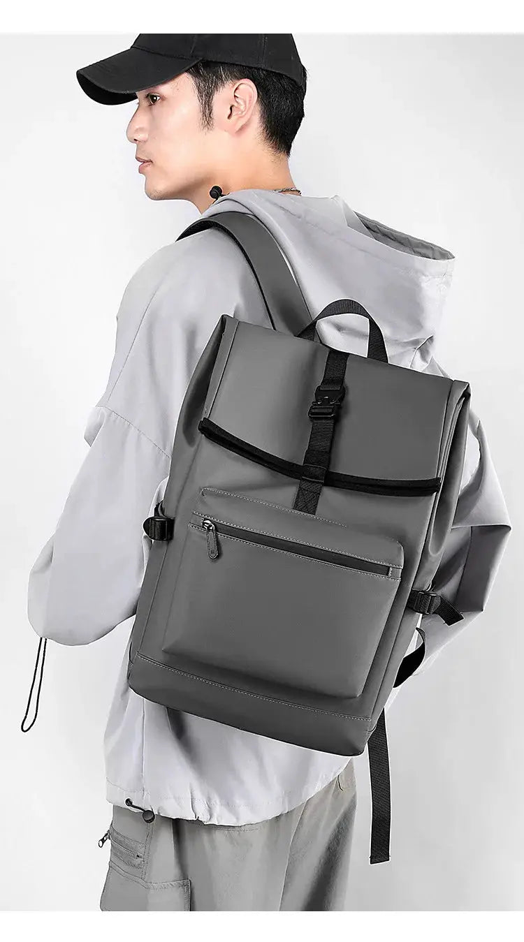 Gray 17-inch urban men's large-capacity laptop backpack with front zip pocket and buckle-fastened flap