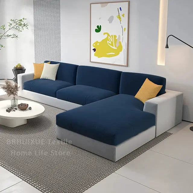 Velvet sofa seat cushion covers in navy blue for an L-shaped sectional with a gray base and mustard pillows.