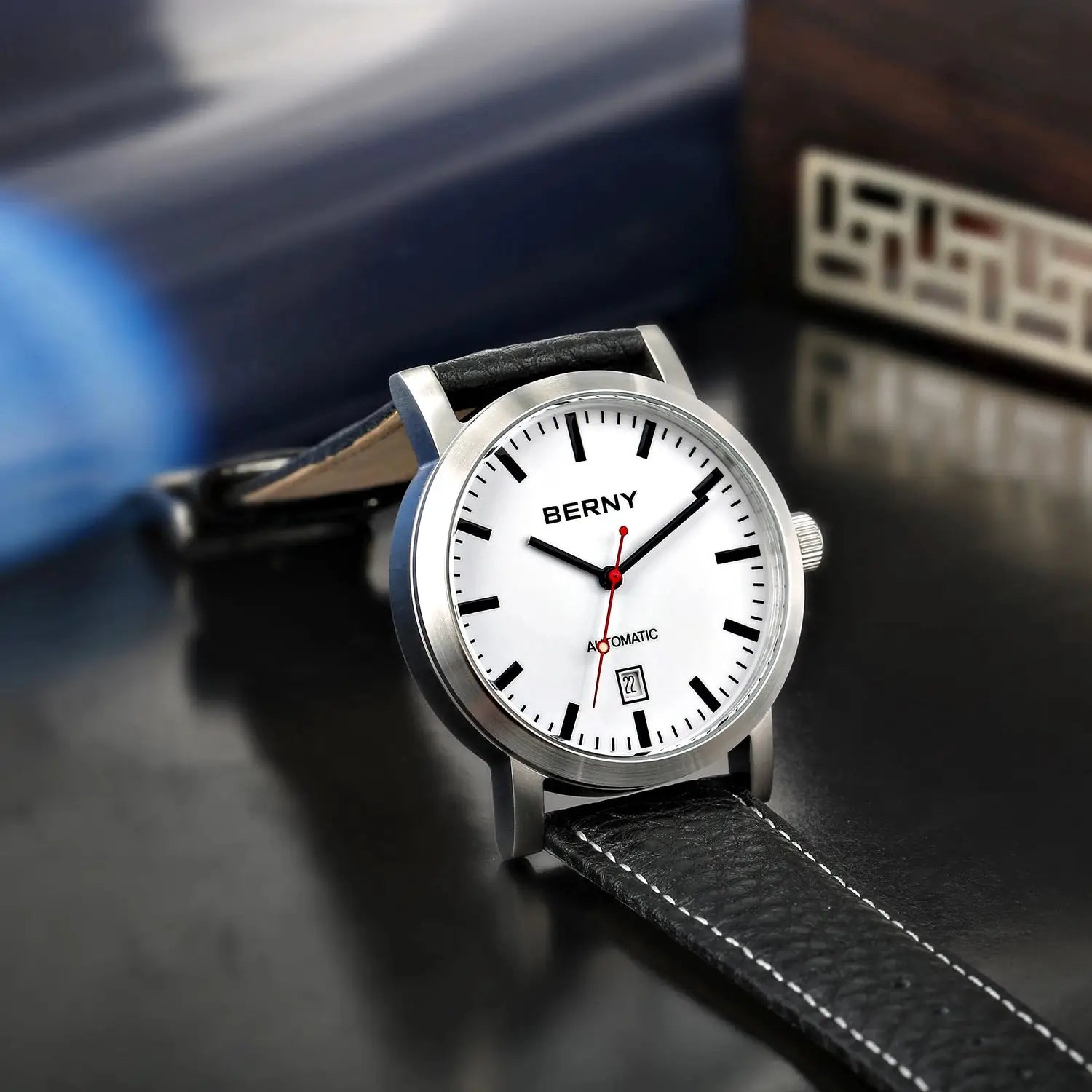 BERNY men's automatic wristwatch with white dial, stainless steel case, and black leather strap.