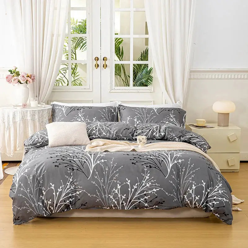 3-piece leaf floral duvet cover set by Simples Market: gray with white botanical print; 1 duvet cover and 2 pillowcases.