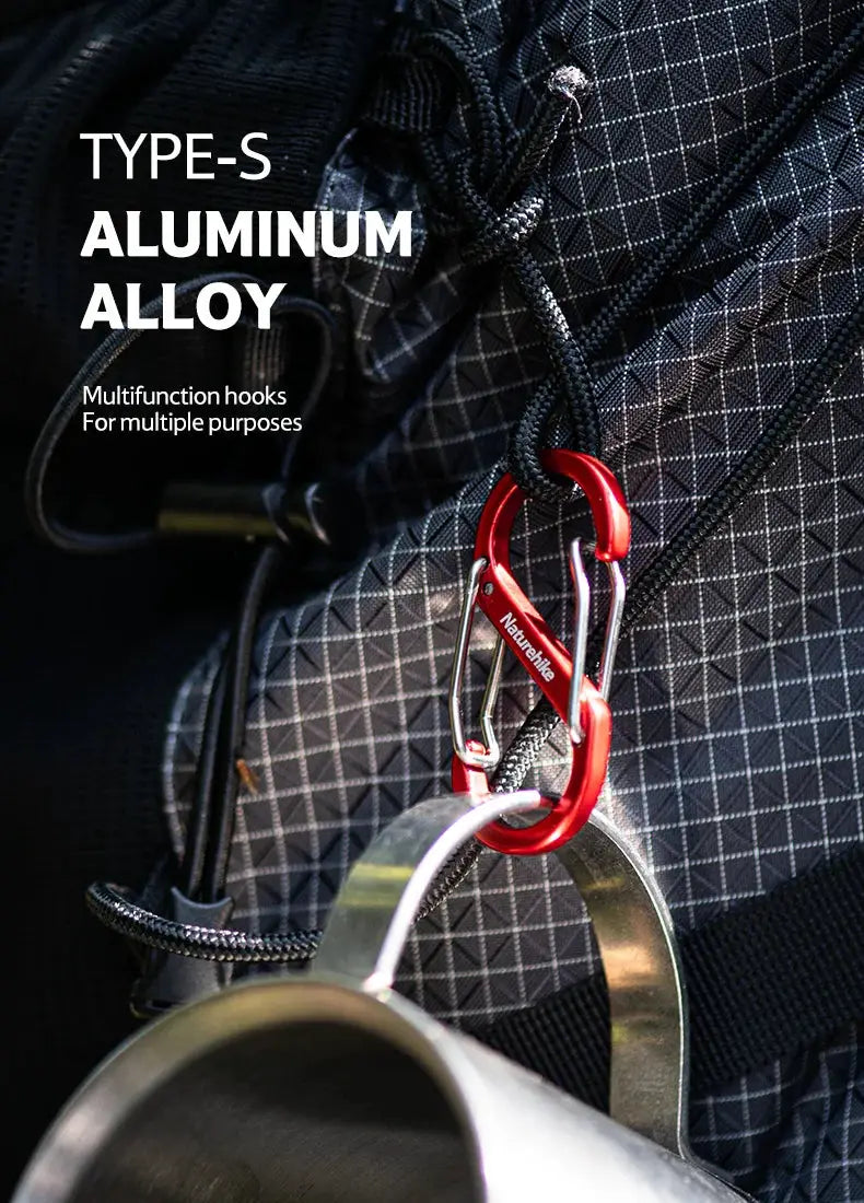 Naturehike S-shaped aluminum alloy buckle with red carabiner keychain on a backpack