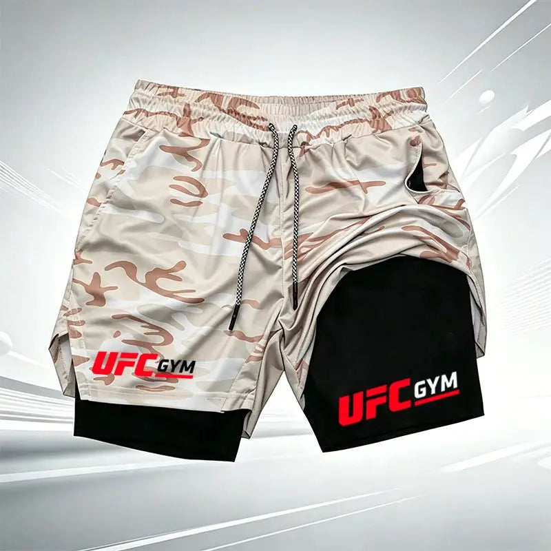 Men's UFC GYM 2-in-1 compression shorts with built-in liner; beige camo outer over black inner, drawstring, UFC GYM logos
