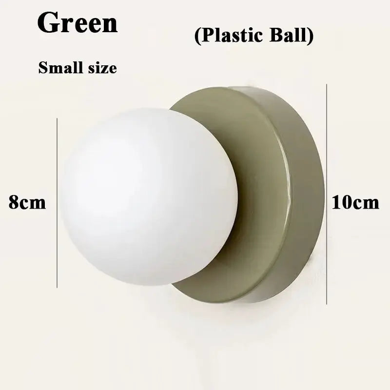 Macaron wall lamp by Simples Market with iron base and plastic ball shade, green, small size, E27