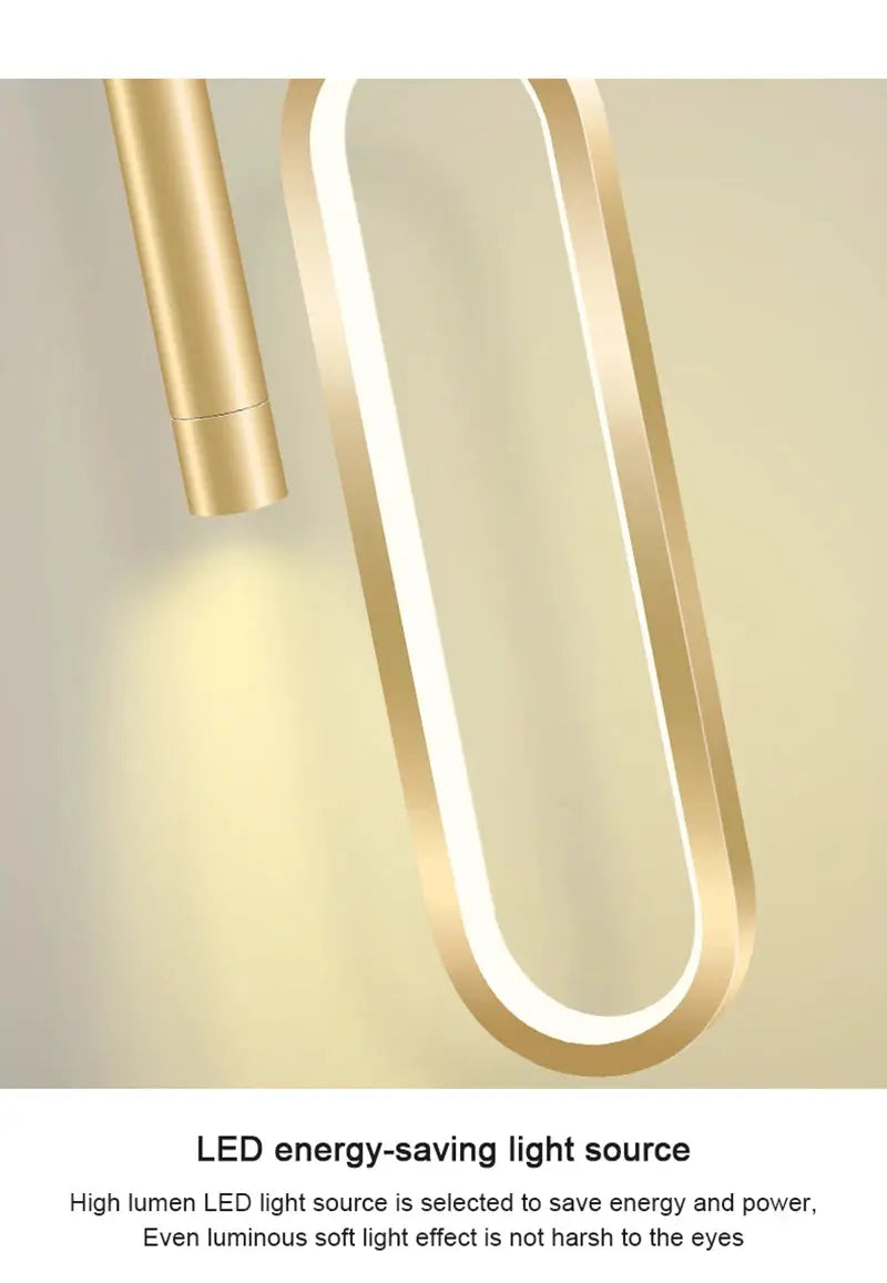 Nordic LED pendant light in gold metal with a curved loop frame for living rooms or dining areas