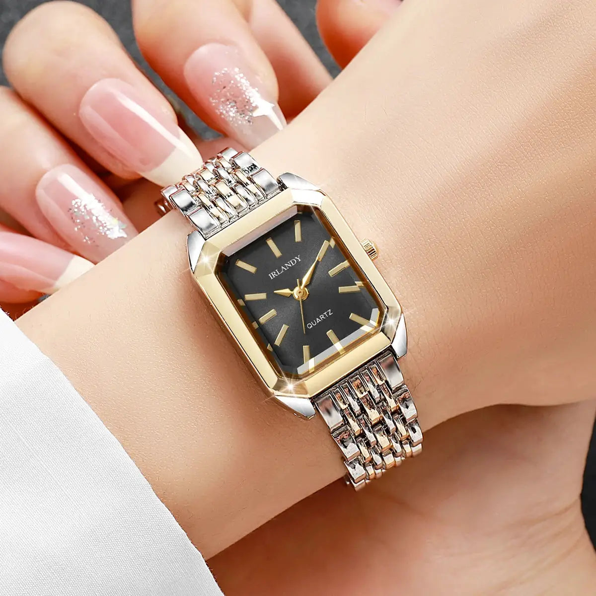 Rectangular women's quartz wristwatch IRLANDY with gold bezel and silver two-tone steel bracelet.