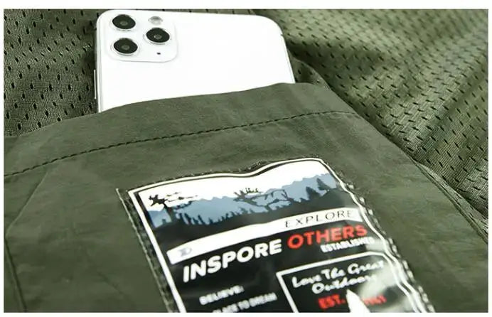 Men's green outdoor cargo vest with breathable mesh fabric and multiple pockets