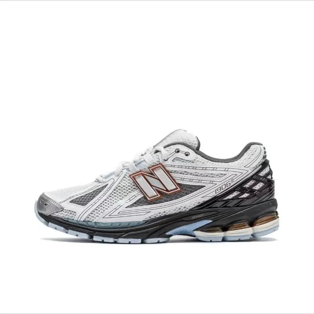 New Balance 1906R running shoe; white mesh upper with breathable design and gray/black sole.