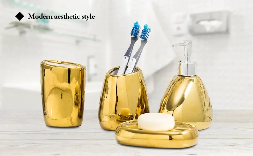 Gold bathroom accessory 4-piece set by Simples Market: soap dispenser, toothbrush holder, mouthwash cup, and tray.