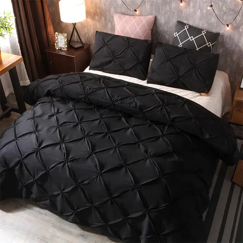 Queen 3-piece gray bed-in-a-bag duvet cover set with pillowcases; tufted design on the bed