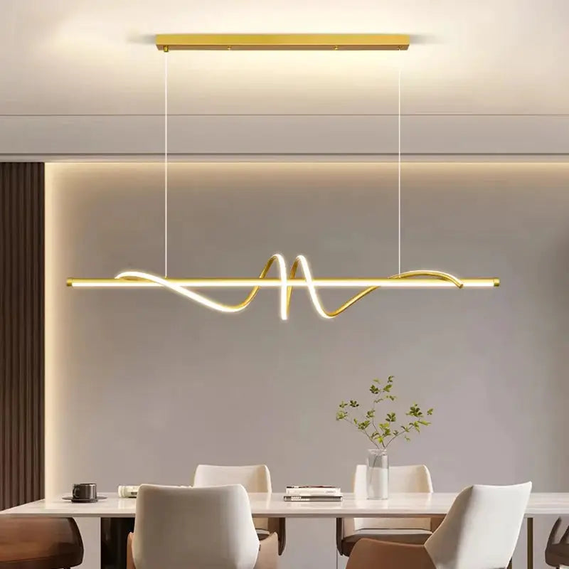 Modern LED pendant light by Simples Market with a gold bar and wavy neon glow over a dining table