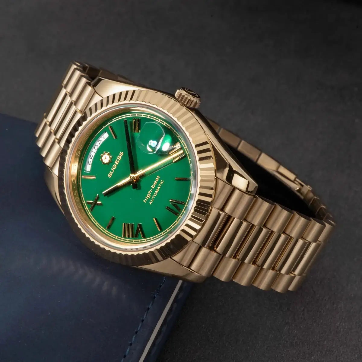 Sugess men's 40mm gold-tone automatic watch with green dial, day/date window, sapphire glass, metal bracelet